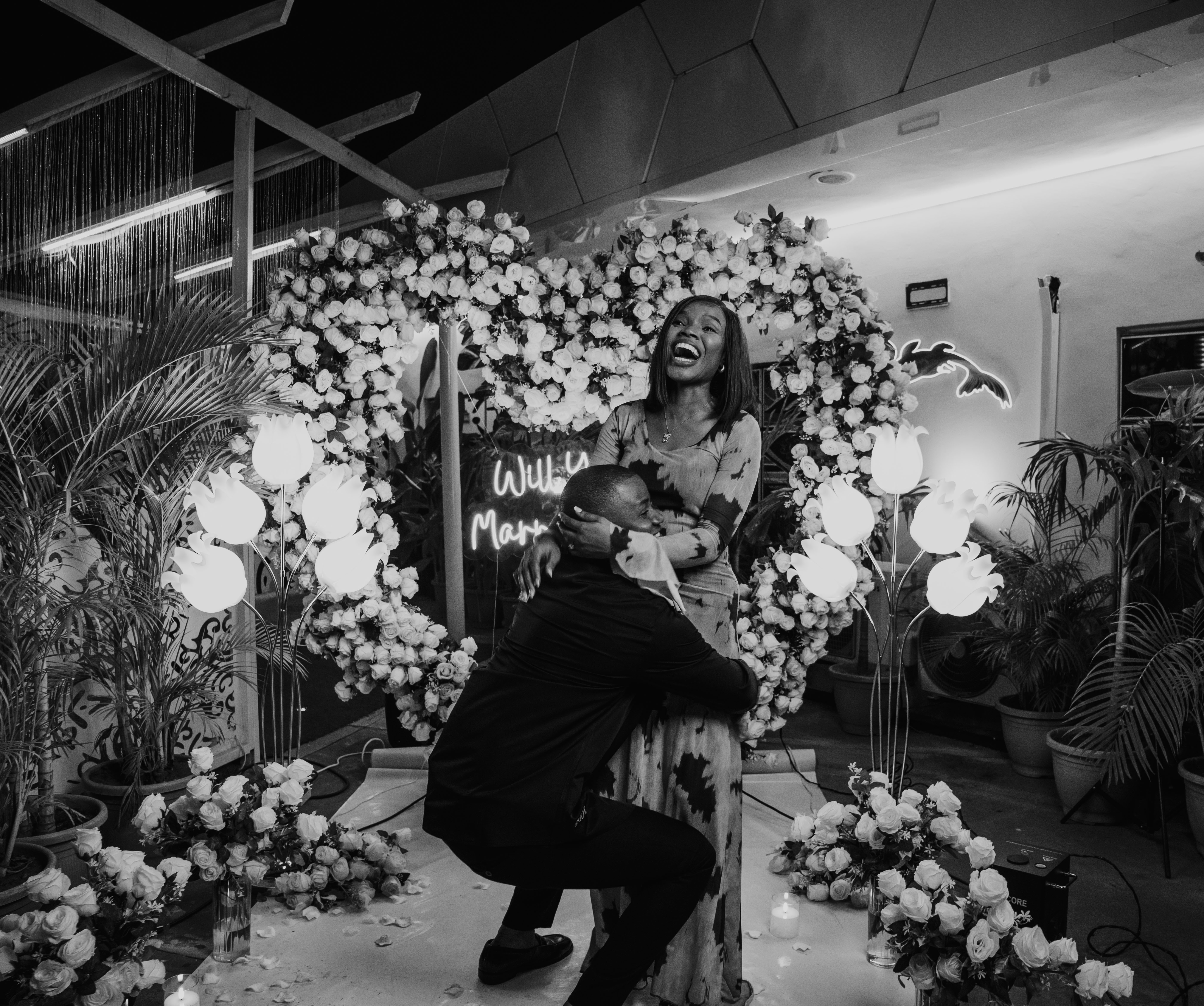 In his arms